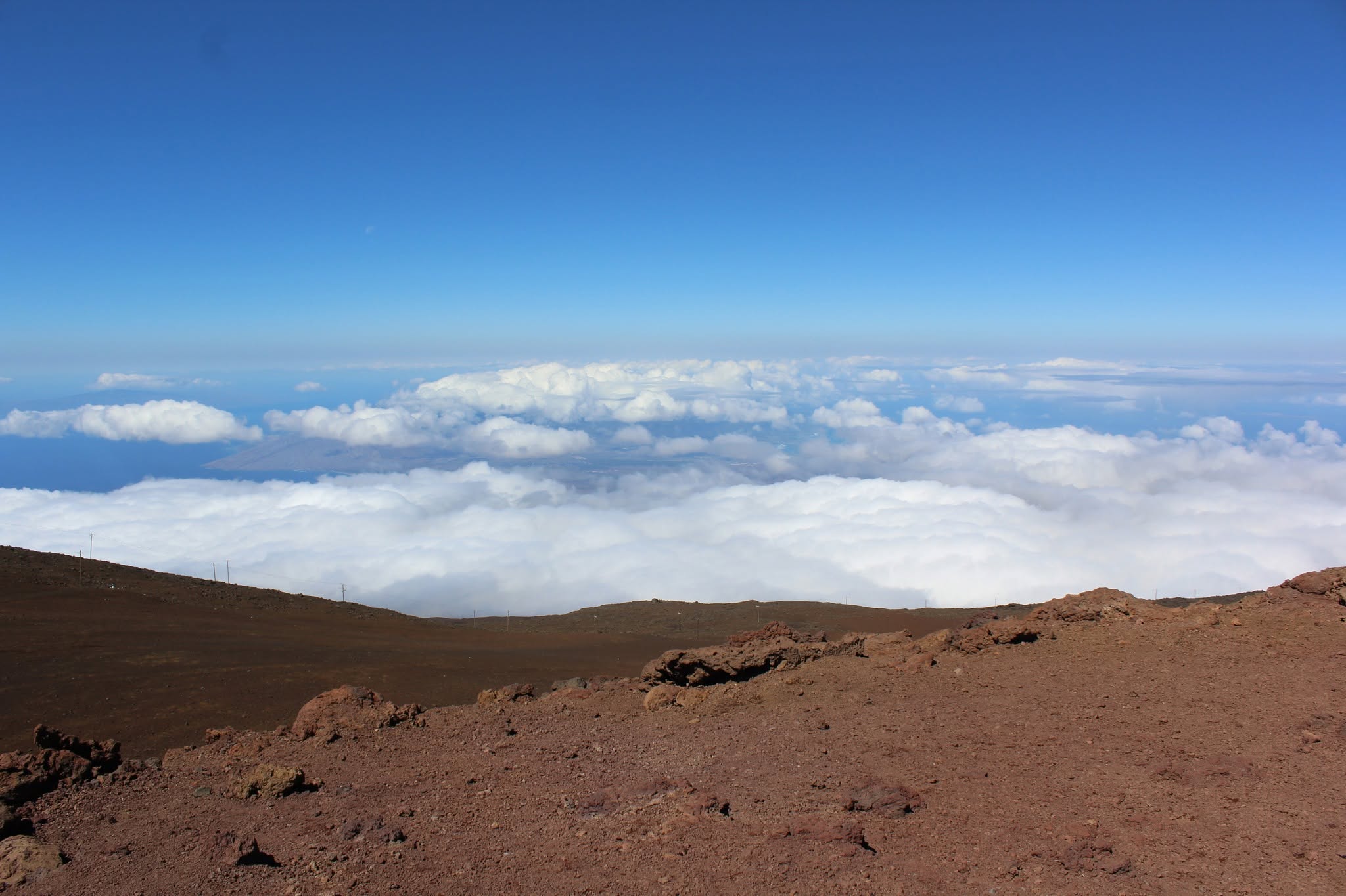 Above the clouds on the red volcanic summit of Haleakalā, Maui