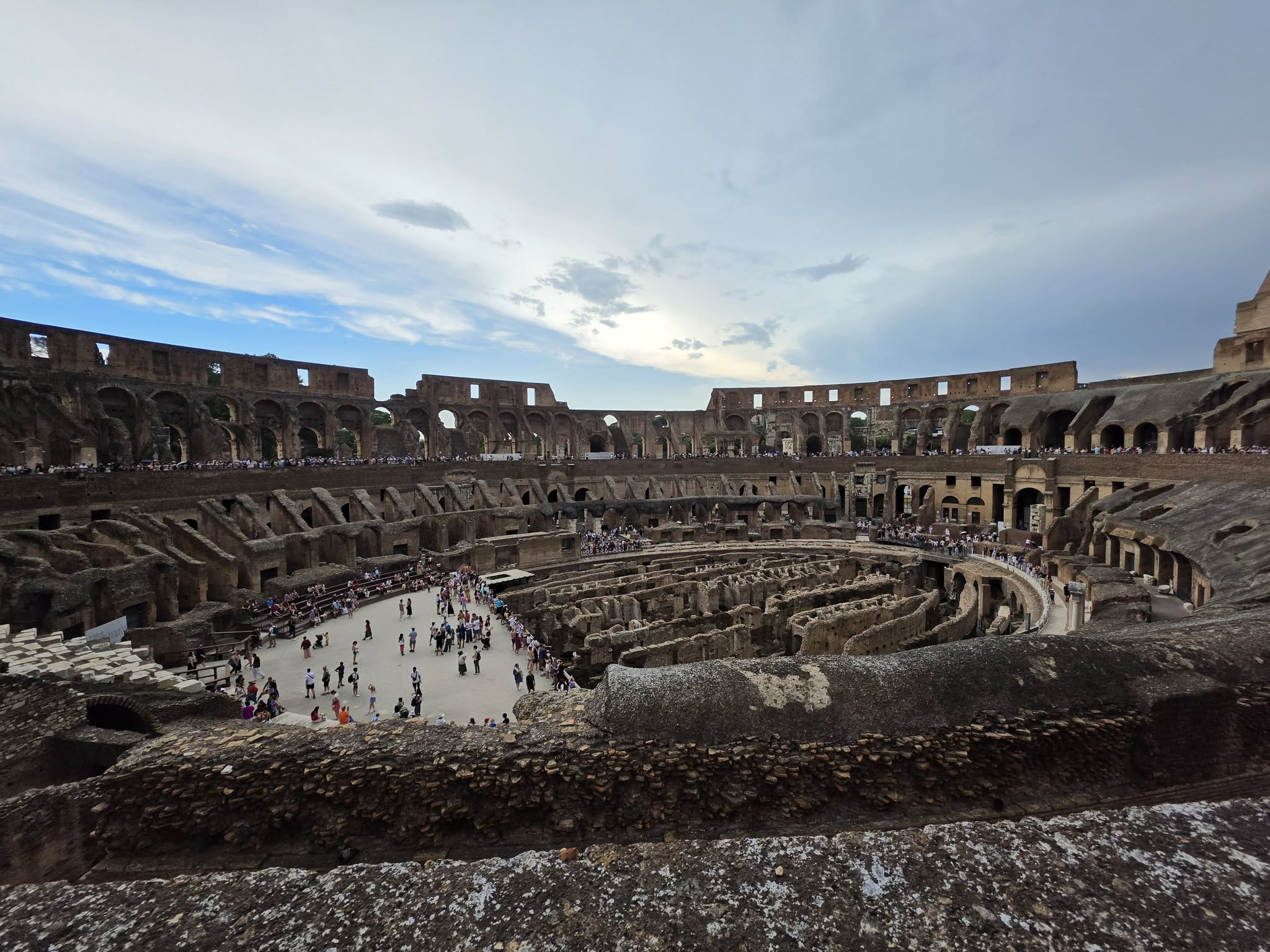 Inside the Colosseum in Rome, looking down at the arena floor